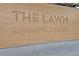 Close-up of 'The Lawn Lawrenceville' signage, showcasing the community gathering place at 1125 Lewis Ridge Cir, Lawrenceville, GA 30045