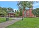 Picturesque town square featuring a gazebo, a historic building, and lush green spaces, perfect for community gatherings at 1125 Lewis Ridge Cir, Lawrenceville, GA 30045