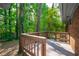 Wood deck overlooking a lush green yard offers a great space for outdoor relaxation and enjoyment at 1671 Drayton Woods Dr, Tucker, GA 30084