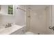 Well-lit bathroom features a tiled shower, updated fixtures, and a window for natural light at 1671 Drayton Woods Dr, Tucker, GA 30084