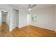 Bright bedroom with hardwood floors, a ceiling fan, a closet and a window offering natural light at 1671 Drayton Woods Dr, Tucker, GA 30084