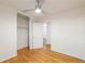 Hardwood floors, a closet and a ceiling fan create a comfortable atmosphere in this bedroom at 1671 Drayton Woods Dr, Tucker, GA 30084