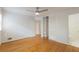 Spacious bedroom with hardwood floors, a closet, and an ensuite bathroom is bathed in natural light at 1671 Drayton Woods Dr, Tucker, GA 30084