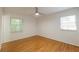 Sunny bedroom with hardwood floors and two windows at 1671 Drayton Woods Dr, Tucker, GA 30084