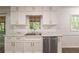 Beautifully updated kitchen with stainless steel appliances and marble countertops at 1671 Drayton Woods Dr, Tucker, GA 30084
