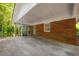 A covered patio offering an outdoor retreat with brick accents and view of the backyard at 1671 Drayton Woods Dr, Tucker, GA 30084