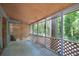 Relaxing screened-in porch offers views of the serene backyard and surrounding greenery at 1671 Drayton Woods Dr, Tucker, GA 30084