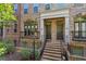 Brick townhome showcases elegant entrances with stone steps and wrought iron accents at 2380 Crescent Park Ct # 4, Atlanta, GA 30339