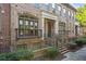 Charming brick townhome features a wrought iron balcony and manicured landscaping at 2380 Crescent Park Ct # 4, Atlanta, GA 30339
