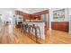 Open-concept kitchen boasts a breakfast bar, stainless steel appliances, and custom cabinets at 2380 Crescent Park Ct # 4, Atlanta, GA 30339