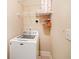 A well-organized laundry room with a white washing machine and shelving for ample storage at 2380 Crescent Park Ct # 4, Atlanta, GA 30339