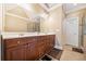 Large bathroom with double vanity, dark cabinets and a tiled floor at 2380 Crescent Park Ct # 4, Atlanta, GA 30339