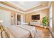 Well-lit bedroom featuring a tray ceiling, with easy access to the main bathroom at 2380 Crescent Park Ct # 4, Atlanta, GA 30339