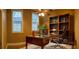 Office space with rich wood desk, built-in bookcase, and neutral walls at 2380 Crescent Park Ct # 4, Atlanta, GA 30339