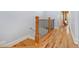 A look down a wooden staircase with metal railings leading to the ground floor at 2380 Crescent Park Ct # 4, Atlanta, GA 30339