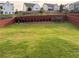 Large backyard with a green lawn and privacy fence at 442 Snow Owl Way, Lawrenceville, GA 30044