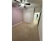 Bedroom with neutral carpet, double door closet and ceiling fan at 442 Snow Owl Way, Lawrenceville, GA 30044