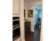 Passageway with a bar and a wine storage unit, adjacent to the kitchen and dining area at 442 Snow Owl Way, Lawrenceville, GA 30044