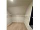 A well-lit walk-in closet with built-in shelving at 442 Snow Owl Way, Lawrenceville, GA 30044
