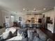 Spacious kitchen with a center island, white cabinetry, stainless steel appliances, and pendant lighting at 442 Snow Owl Way, Lawrenceville, GA 30044