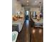 Modern kitchen featuring white cabinets, stainless steel appliances, and hardwood floors at 442 Snow Owl Way, Lawrenceville, GA 30044