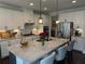 Gourmet kitchen with granite countertops, stainless steel appliances, and custom cabinetry at 442 Snow Owl Way, Lawrenceville, GA 30044