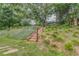 Landscaped backyard featuring a wooden staircase at 105 Silver Trce, Dallas, GA 30157