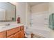 Bright bathroom featuring a vanity, shower-tub combination, and modern fixtures at 105 Silver Trce, Dallas, GA 30157