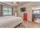 Bedroom featuring carpet, natural light, and a TV. A connected room is visible at 105 Silver Trce, Dallas, GA 30157