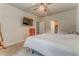 A comfortable bedroom with carpet, TV, and a connecting bathroom. Natural light fills the room at 105 Silver Trce, Dallas, GA 30157