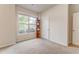 Neutral bedroom with a large window, carpet and a view of the outdoors at 105 Silver Trce, Dallas, GA 30157