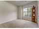 Neutral bedroom with large window, carpet and decorative bookshelf at 105 Silver Trce, Dallas, GA 30157