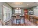 Cozy dining area adjacent to the kitchen features a dining table and access to the backyard at 105 Silver Trce, Dallas, GA 30157