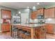 Well-equipped kitchen with granite countertops, island with bar seating, and stainless steel appliances at 105 Silver Trce, Dallas, GA 30157
