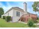 Backyard with a deck and steps down to a manicured yard at 1239 Brentwood Ct, Douglasville, GA 30135