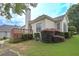 Backyard with a deck and manicured bushes at 1239 Brentwood Ct, Douglasville, GA 30135