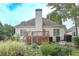 Manicured backyard with a deck and bird bath at 1239 Brentwood Ct, Douglasville, GA 30135