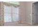 Well-lit bedroom featuring a large window and neutral decor at 1239 Brentwood Ct, Douglasville, GA 30135