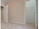 Neutral bedroom with a door to a walk-in closet with wire shelving at 1239 Brentwood Ct, Douglasville, GA 30135