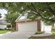 Attached two car garage with brick and siding exterior at 1239 Brentwood Ct, Douglasville, GA 30135