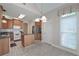 Eat-in kitchen featuring tile floors, wood cabinets, granite countertops and stainless steel appliances at 1239 Brentwood Ct, Douglasville, GA 30135