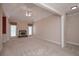 Spacious living room with plush carpeting, fireplace, and natural light from large windows at 1239 Brentwood Ct, Douglasville, GA 30135