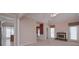Open-concept living room with fireplace, vaulted ceiling and views into the kitchen and dining spaces at 1239 Brentwood Ct, Douglasville, GA 30135