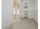 Spacious walk-in closet with lots of shelving and storage space at 1239 Brentwood Ct, Douglasville, GA 30135