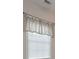Window treatment with off white valance and white blinds at 1239 Brentwood Ct, Douglasville, GA 30135