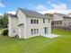 Backyard with a well-manicured lawn, a concrete patio, and access to the home via a sliding glass door at 3609 Indigo Creek Nw Trl, Kennesaw, GA 30144