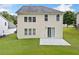 Backyard with a well-manicured lawn, a concrete patio, and access to the home via a sliding glass door at 3609 Indigo Creek Nw Trl, Kennesaw, GA 30144
