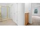 Bright bathroom featuring a glass-enclosed shower and neutral decor at 3609 Indigo Creek Nw Trl, Kennesaw, GA 30144