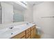 Bathroom featuring double sinks, white cabinets and a large mirror at 3609 Indigo Creek Nw Trl, Kennesaw, GA 30144