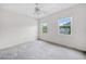 Neutral bedroom with two windows allowing natural light and ceiling fan at 3609 Indigo Creek Nw Trl, Kennesaw, GA 30144